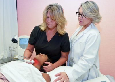 Therapist performing a hands-on massage treatment at our Houston clinic